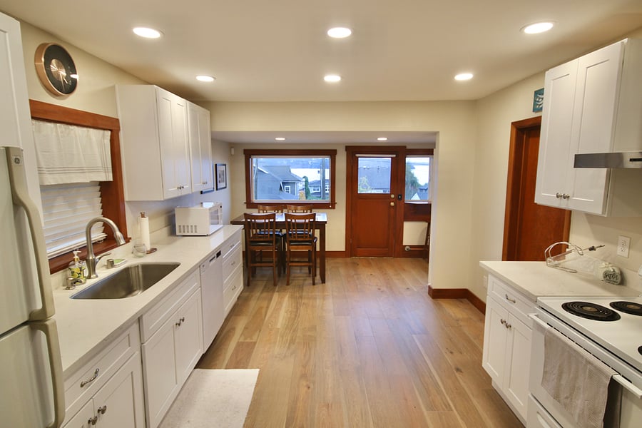Kitchen, eating area, back door, door to bedroom #2.