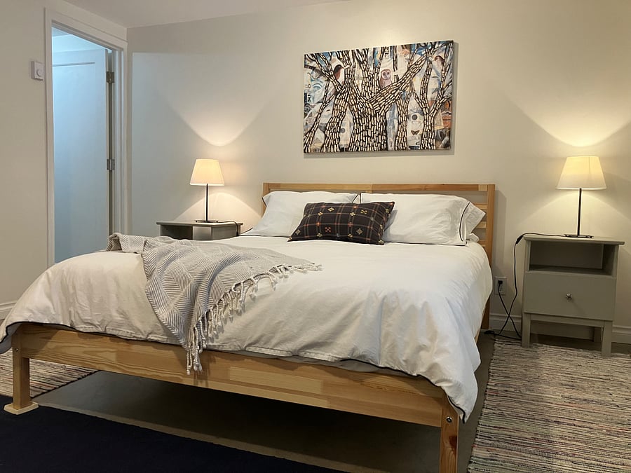larger bedroom, queen-size bed.