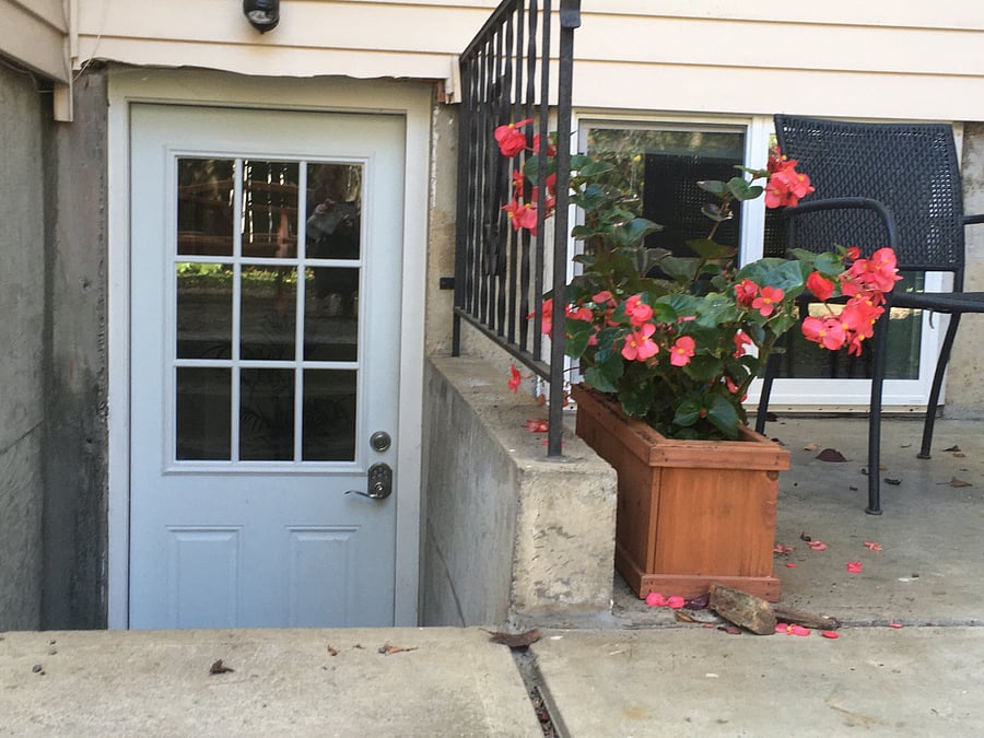 Private entrance with keypad lock. Entrance is at the back of the house with its own patio seating.