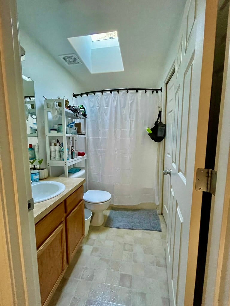 Shared upstairs bathroom with shower and washer/dryer