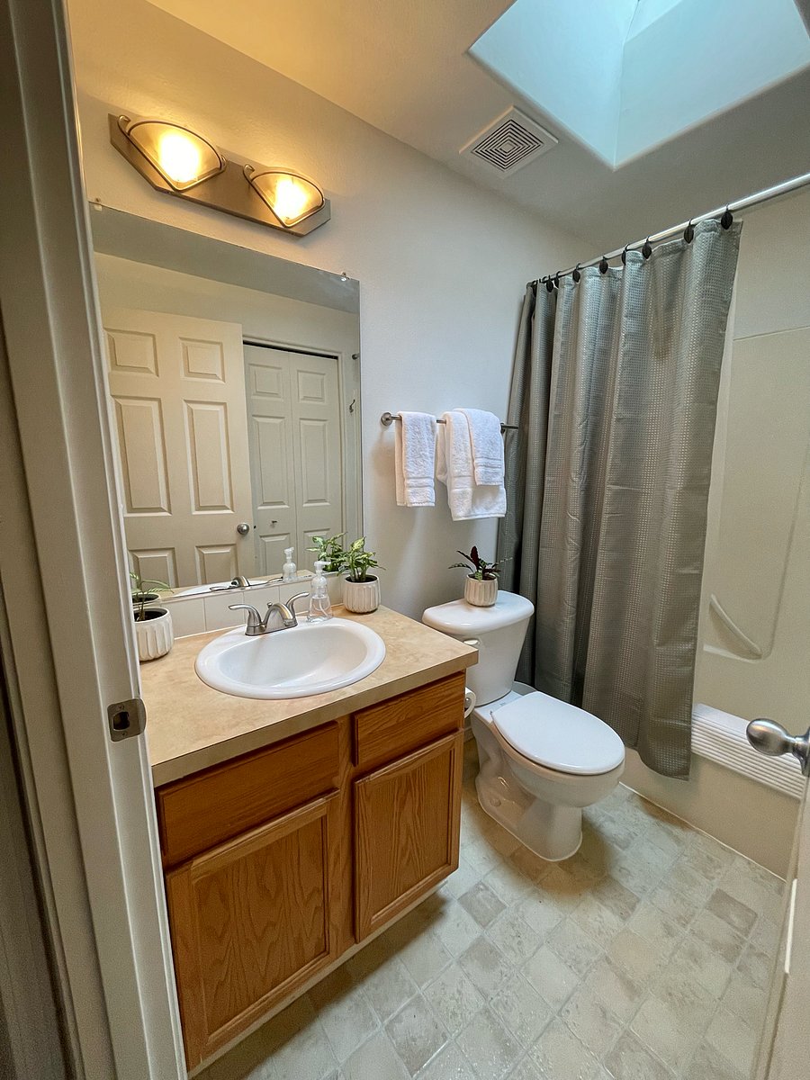 Upstairs shared bathroom with new washer.