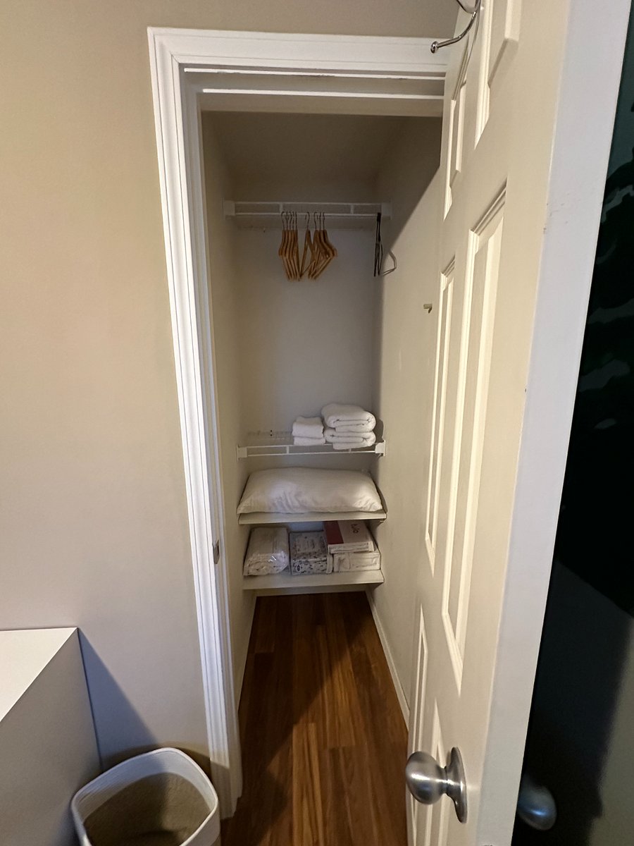 Small full closet with extra sheets and towels. 