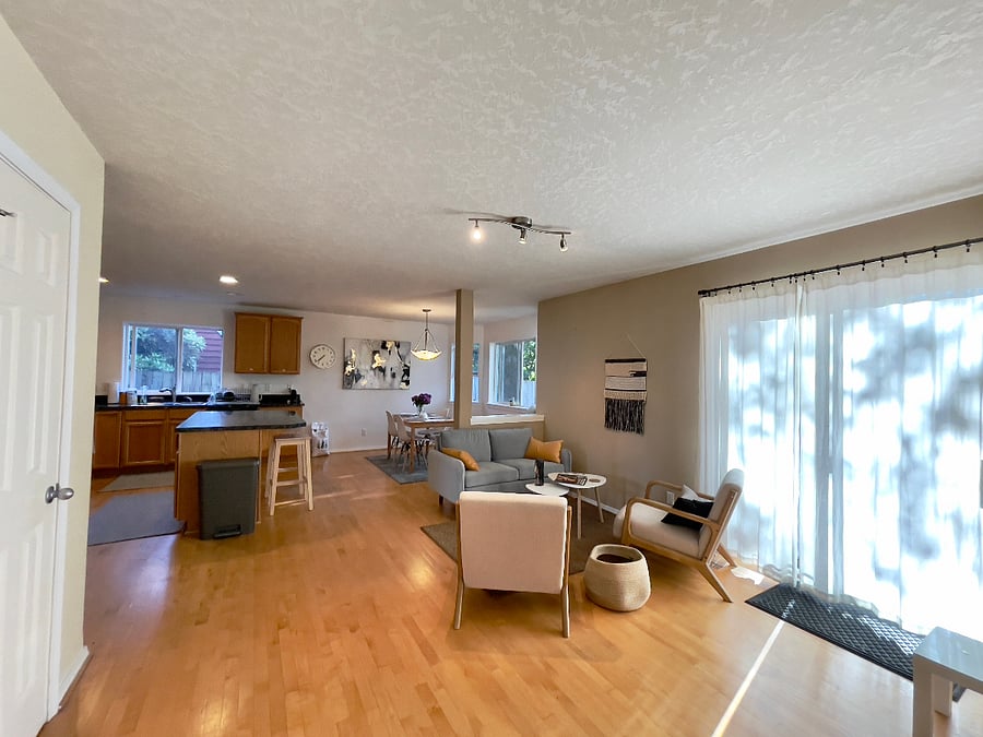 Family room with access to the large fenced backyard.