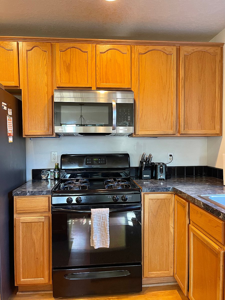Natural gas stove and brand new microwave.