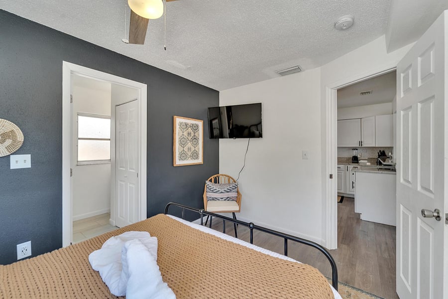 Master bedroom with private bathroom and Smart TV