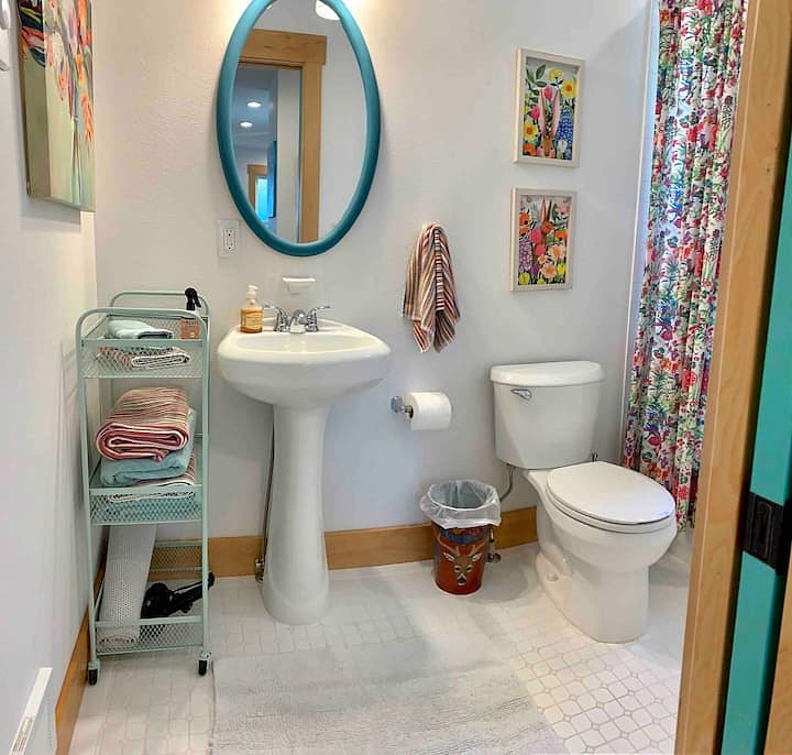 Kitchen with bathtub and shower fully tiled