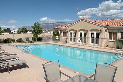 Community Clubhouse and 1 of two pools (both pools opened SEASONALLY).  This pool is on Northwest of Complex looking EAST