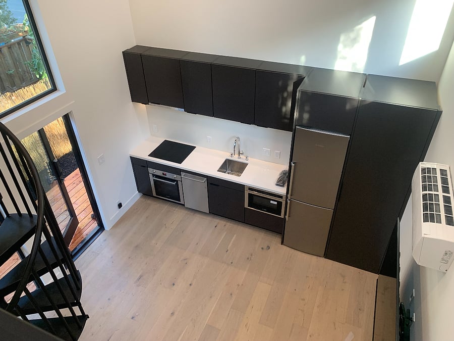 Very spacious feeling inside, with two skylights, many windows and very high ceilings