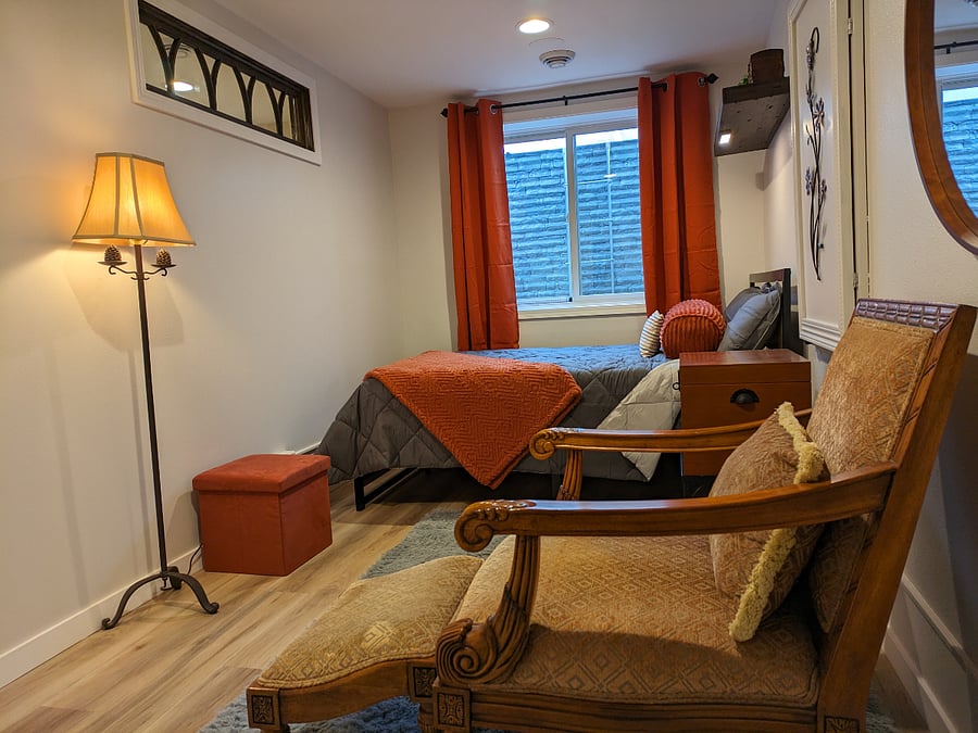 Bedroom view with window offering natural light