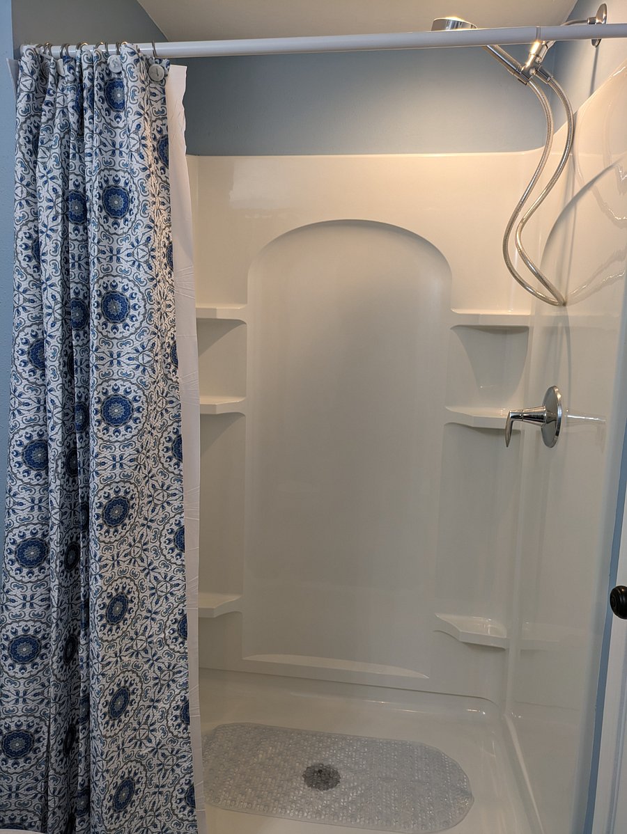 Lower suite tenant shower in bathroom