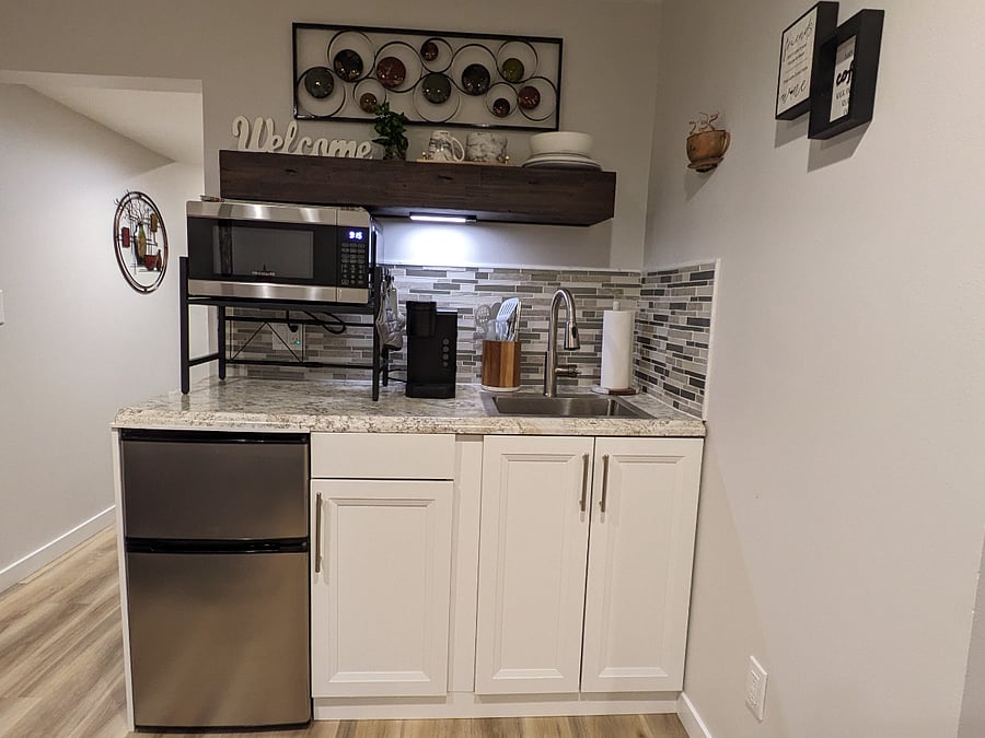 Kitchenette with microwave, mini fridge with freezer, and equipped with the essentials