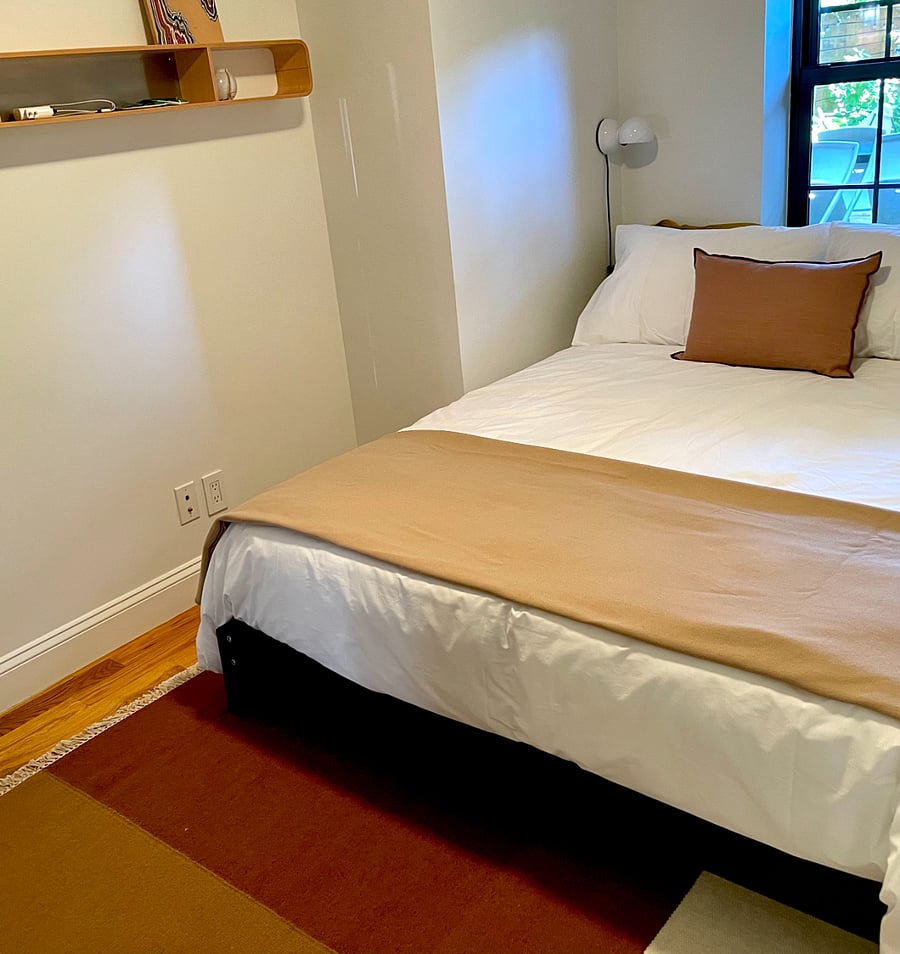 bedroom 2 of 2
Queen bedroom
with cotton percale bedding, Faribault Mills wool blanket, and Ferm living danish modern design wool rug