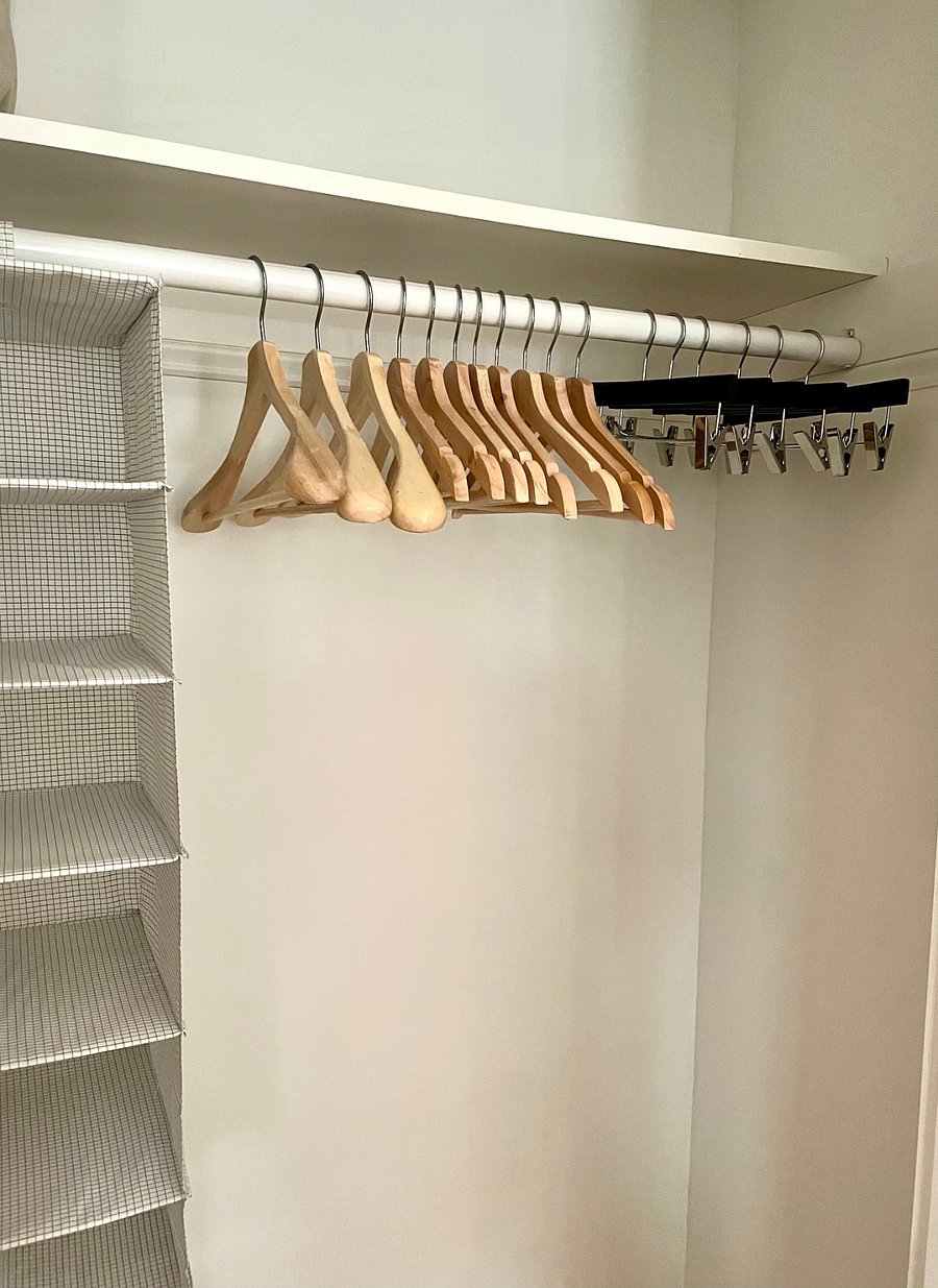 both bedrooms have closets with wooden hangers. Additional storage closets in living area, and storage available in basement.