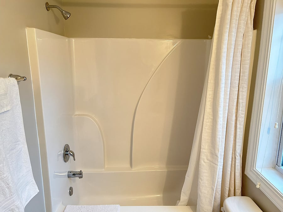 Private en suite bathroom with shower and tub
