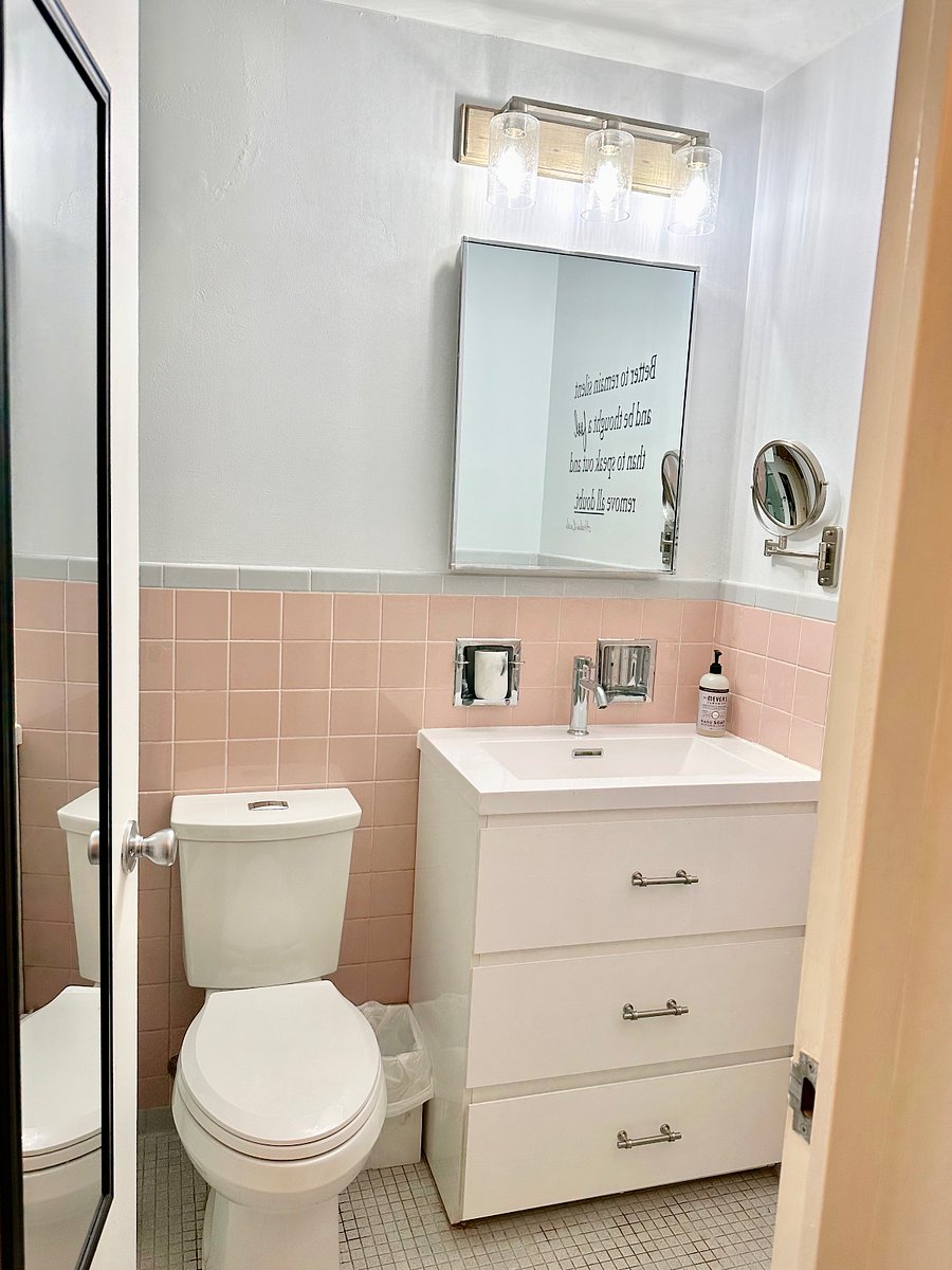 Makeup mirror, new tall toilet with soft close lid, large medicine cabinet, and a new vanity with plenty of storage space.