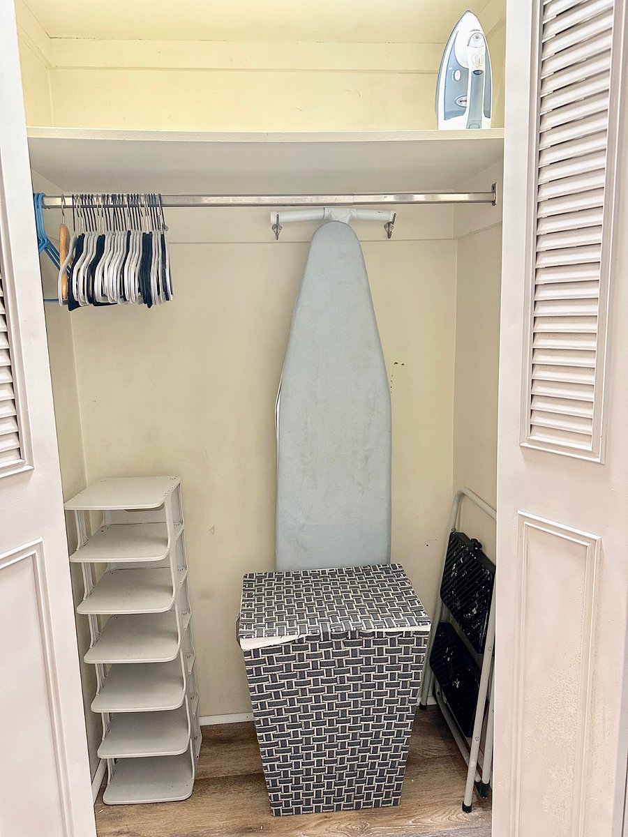 Extra storage rack for shoes saves space, A full sized ironing board and iron, as well as a step stool and laundry hamper provide you with everything you need