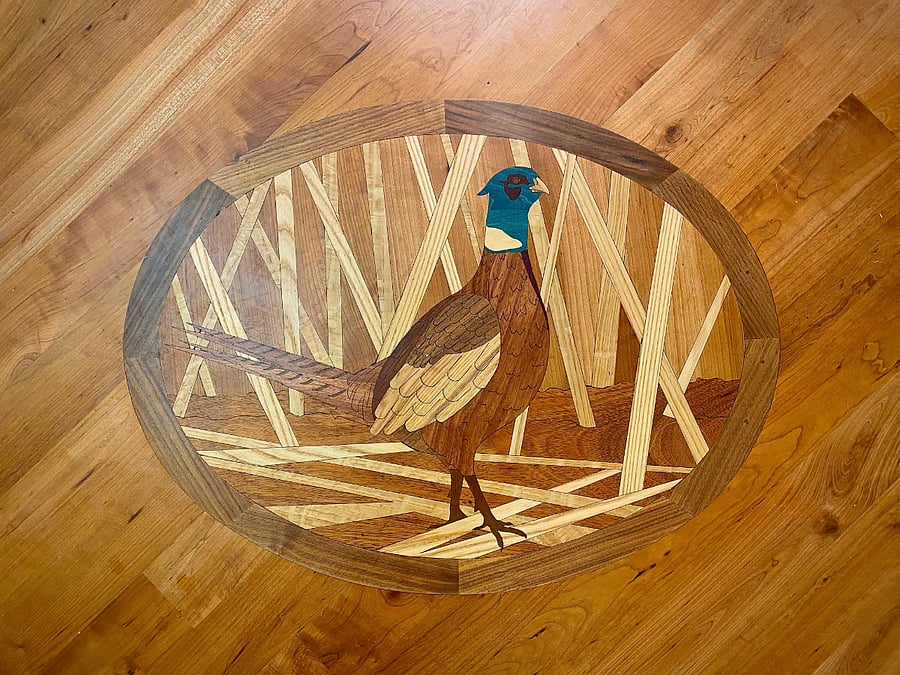 Wood inlay in kitchen...this pheasant is one of the favorite parts of this house.