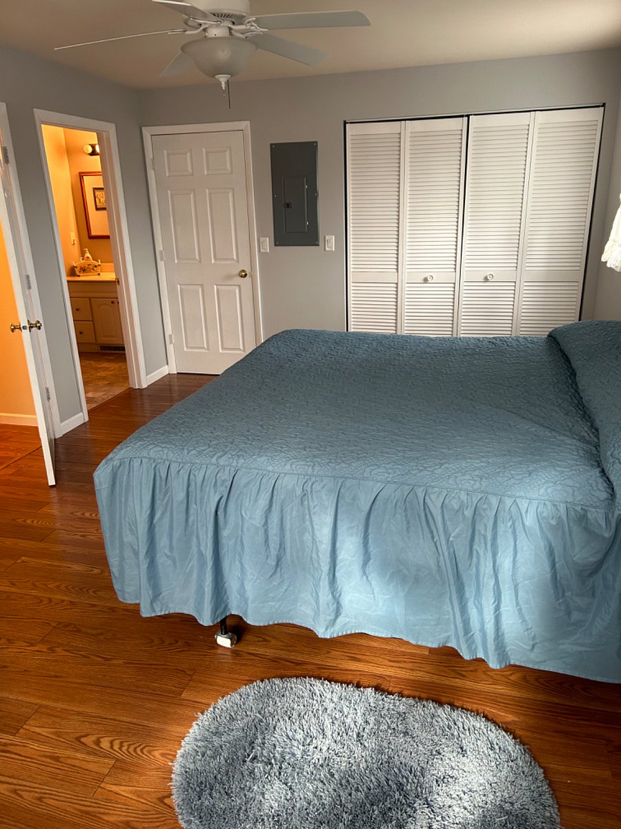 Master bedroom with 3 closets and dresser