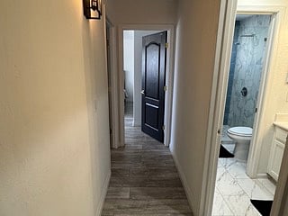 upstairs hallway between bedrooms and bathroom
