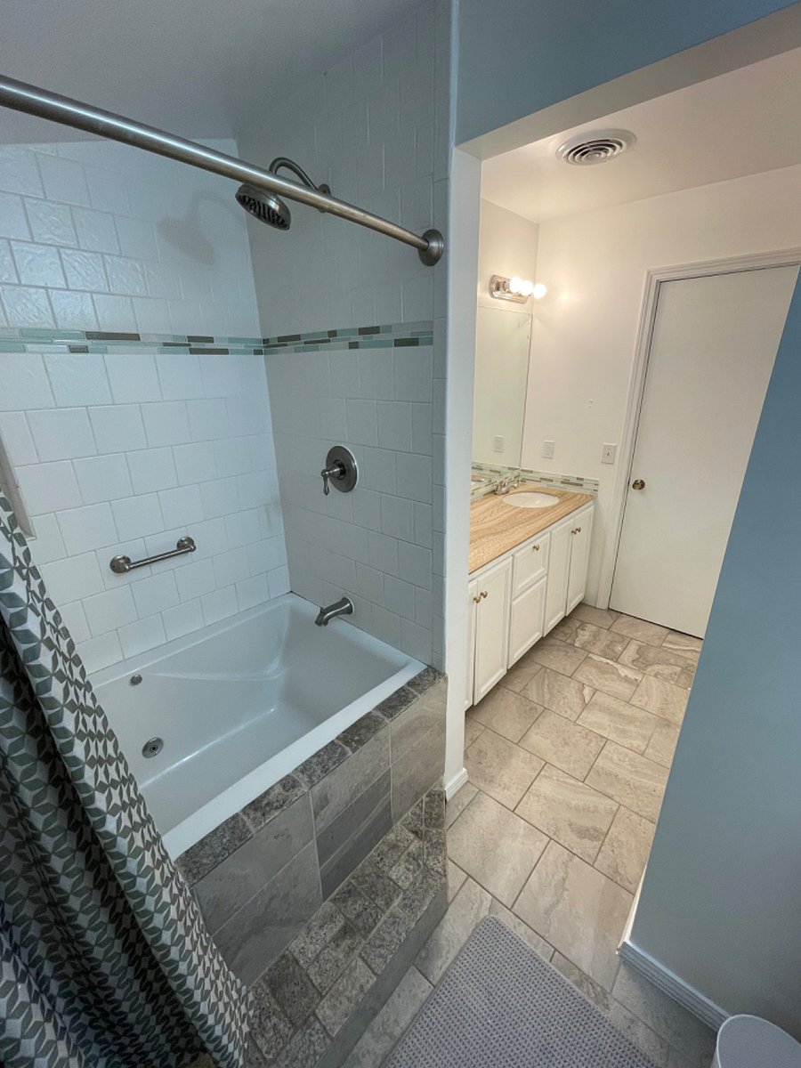 Ocean skies Master bathroom with whirlpool tub and shower combo