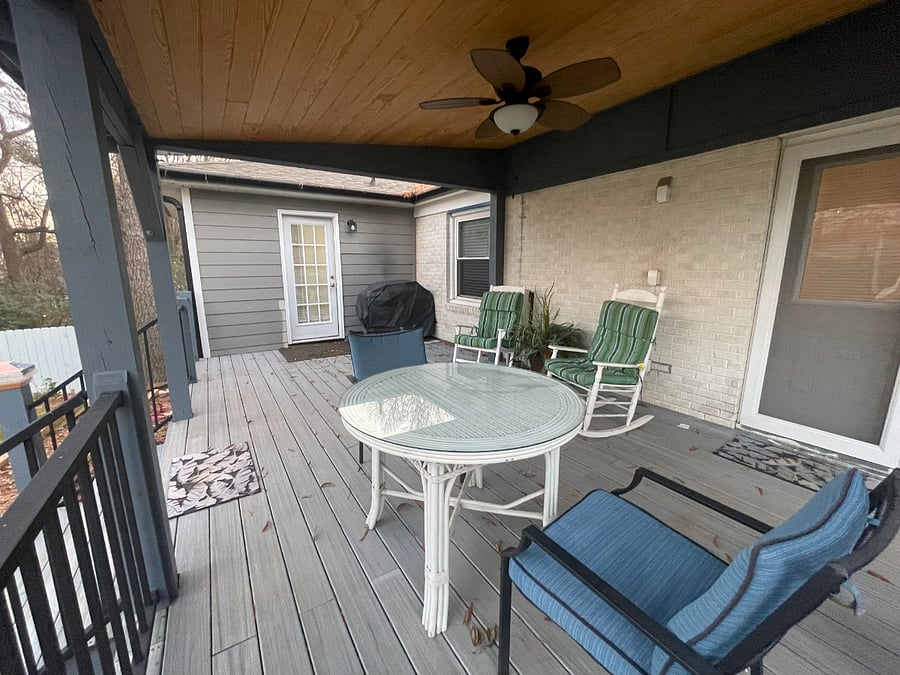Beautiful covered porch and bbq grill.