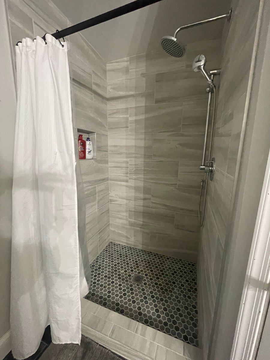 Primary bathroom has oversized walk-in shower.