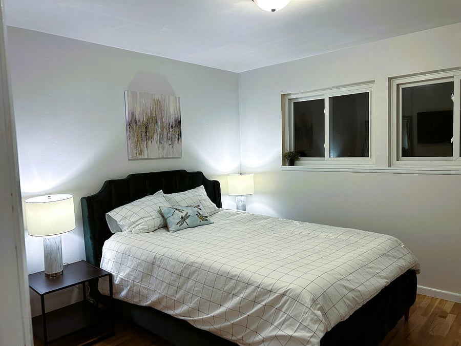 "Dragonfly Room is the larger bedroom on the SW corner of the home with views of mountains and cityscape.