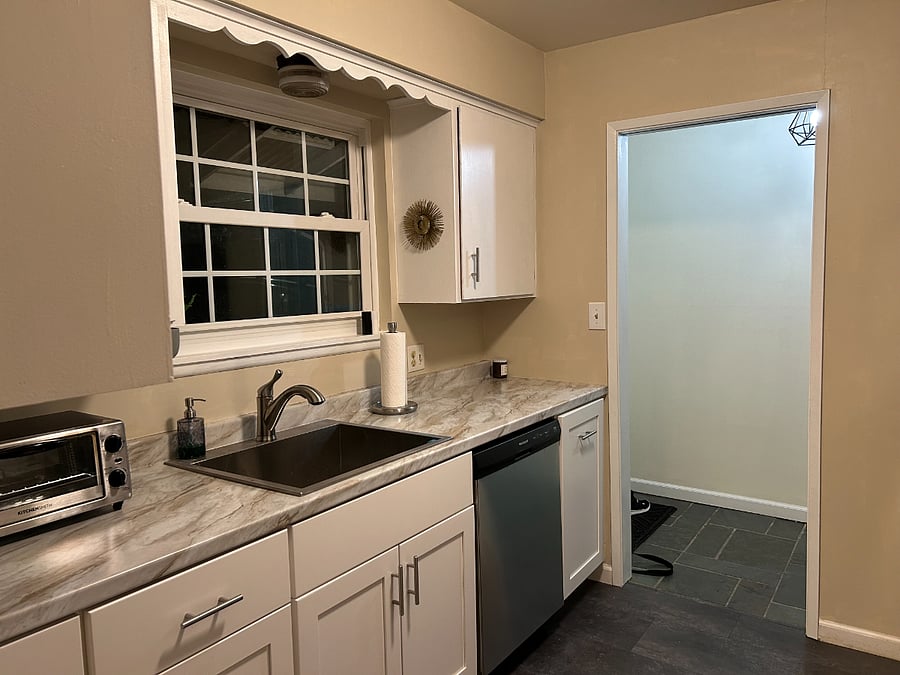Brand new soft close lower cabinets with deep stainless steel sink with garbage disposal and spray faucet. Includes Kuerig and toaster oven (or regular toaster if preferred)