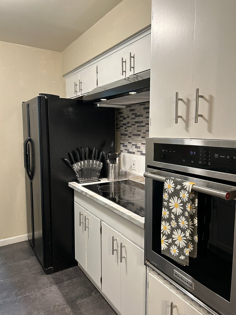 Recently freshened up kitchen with glass cooktop and updated oven, dishwasher and microwave (in cupboard)