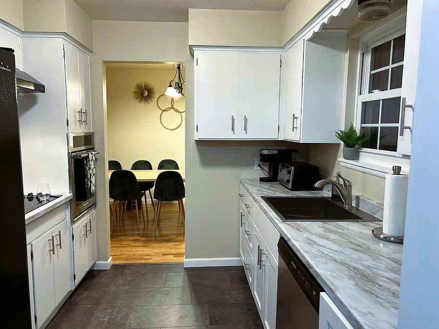 Wide Galley Kitchen accessed right off the front door or through the dining area on the way out to the living room. All utensils, pots, pans, silverware, glassware and dishes for 8 provided.