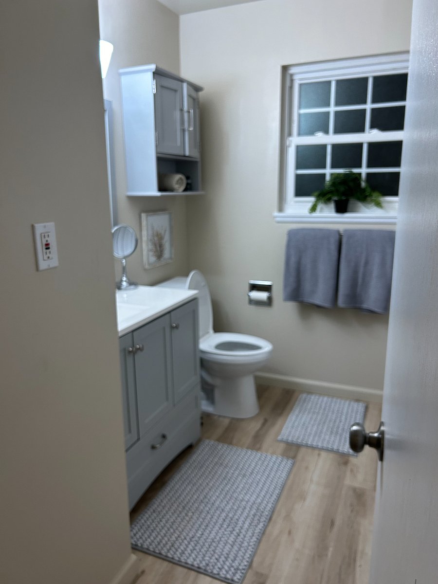Updated bathroom with new floors, tub surround, vanityand toilet in the past year!