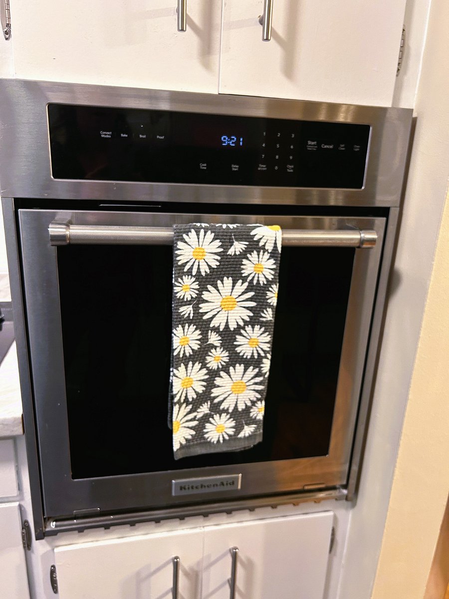 Newish oven with new microwave tucked into the cupboard above.