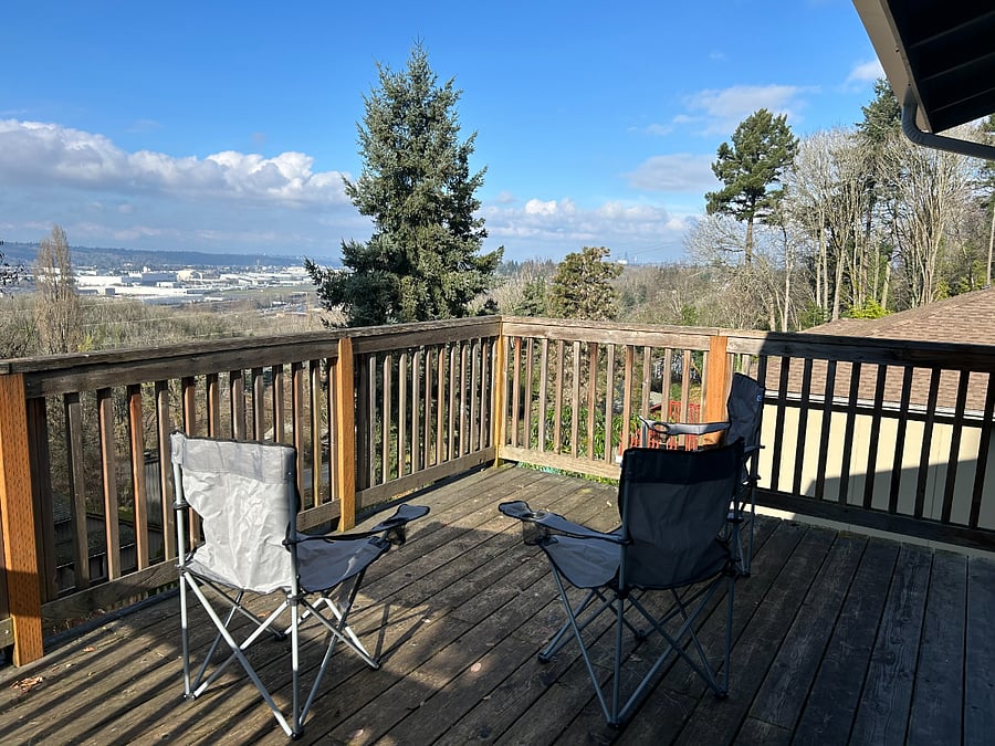 Views for days from the deck off this units. Seattle skyline on the right and Boeing field and Olympics on the center-left