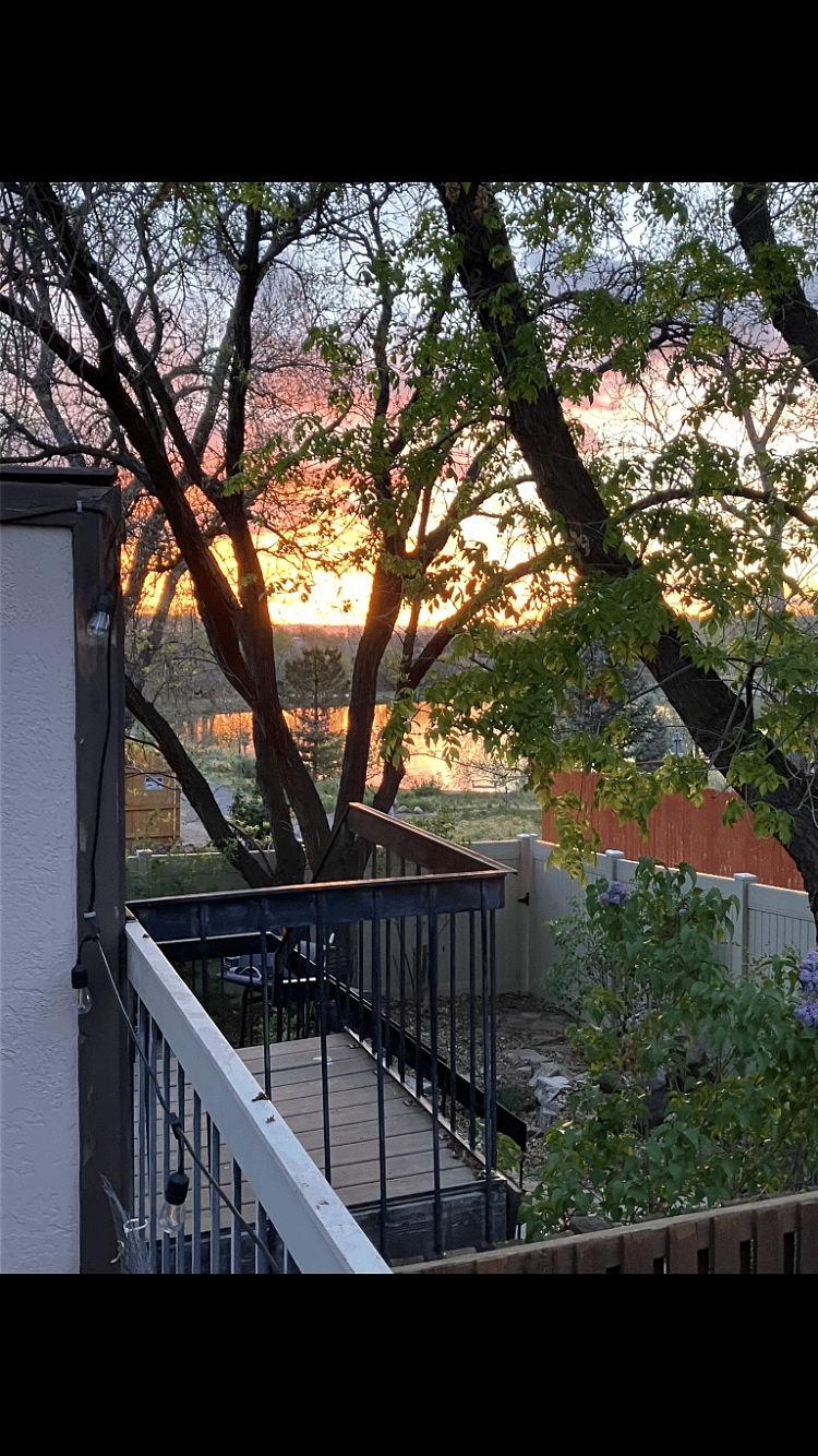 Large upper deck has view of lake. The back gate opens to a path to a walking trail around the lake, with benches along the way.