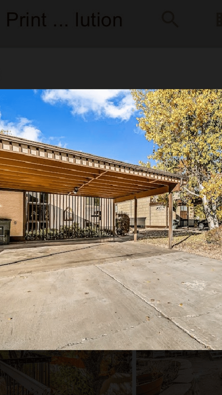 Carport covers 2 cars and the driveway can hold an additional 2 cars