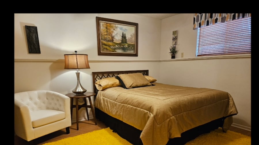 Lower level queen bed, has flatscreen WiFi TV