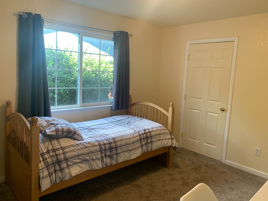 Room for rent--view from closet area of interior door to bathroom