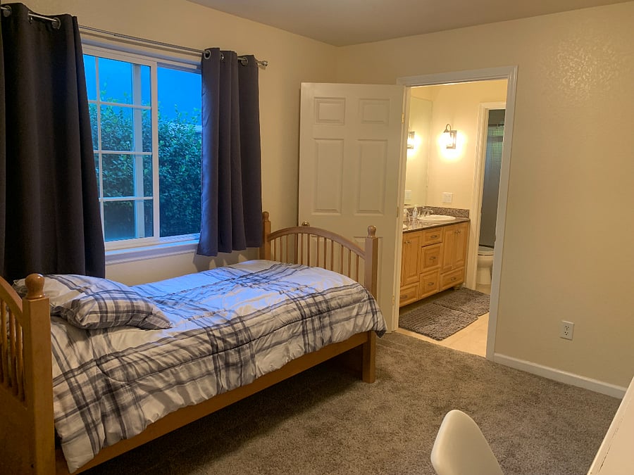 Room for rent--view from closet area of interior door to bathroom open