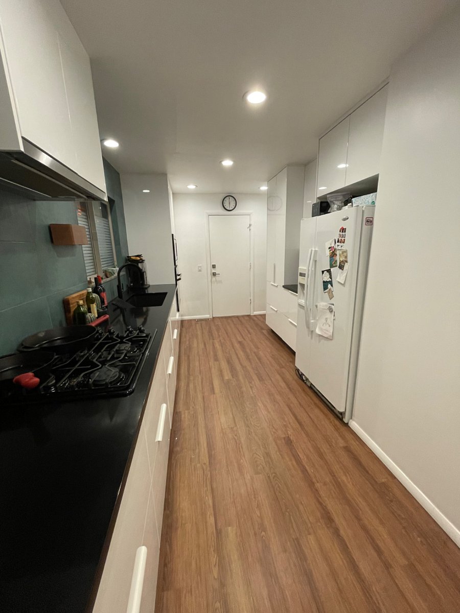 Newly remodeled galley kitchen with gas range