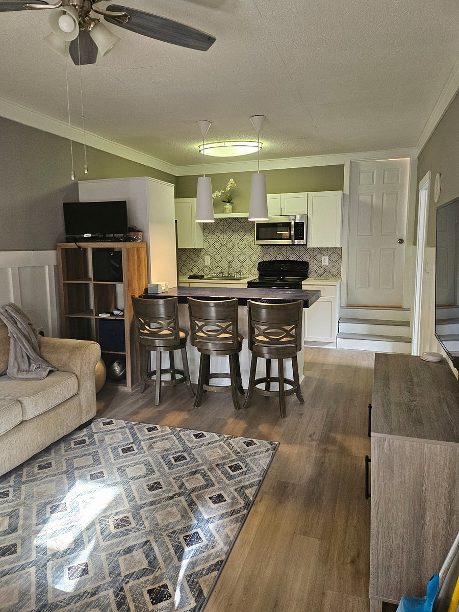 living room looking into kitchen with breakfast bar