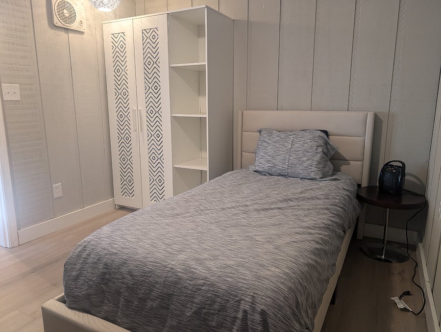 2nd bedroom with single bed and wardrobe