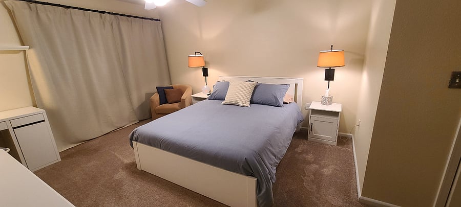 Master bedroom includes a comfortable NEW queen Nectar hybrid mattress, BLACKOUT CURTAINS, cozy reading chair and new bedding!
