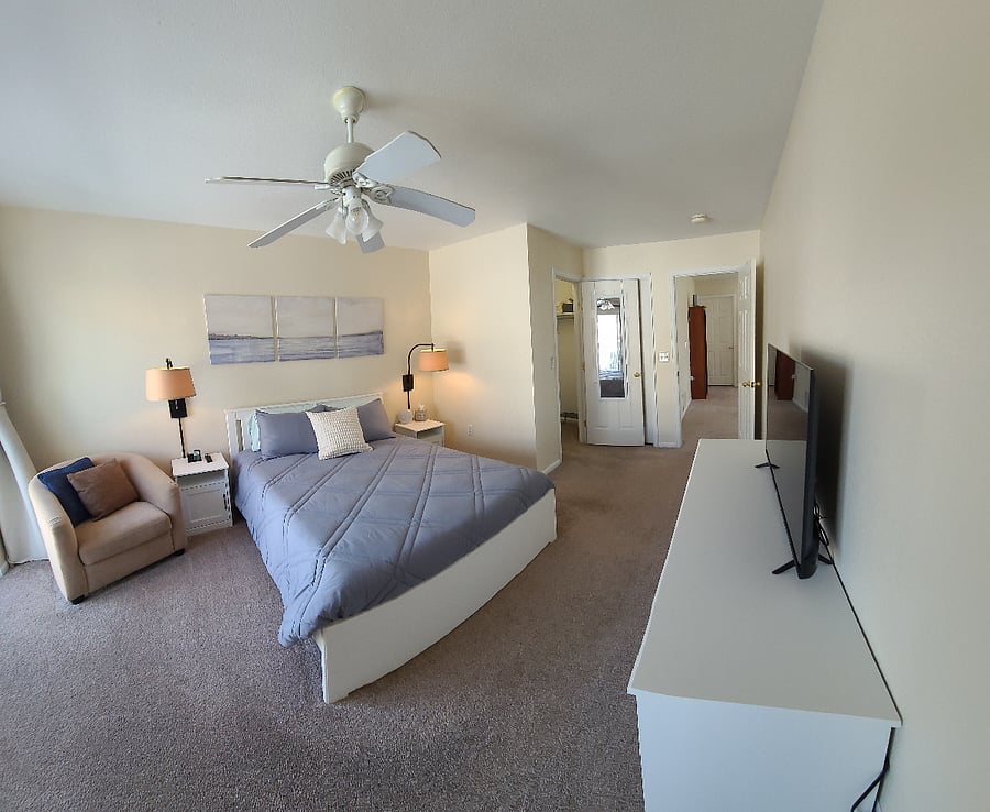 Master bedroom includes a comfortable NEW queen Nectar hybrid mattress, BLACKOUT CURTAINS, cozy reading chair and new bedding!