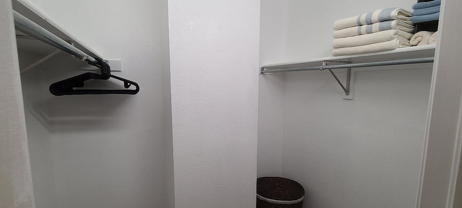 Walk-in closet w/ hangers and LOTS of storage