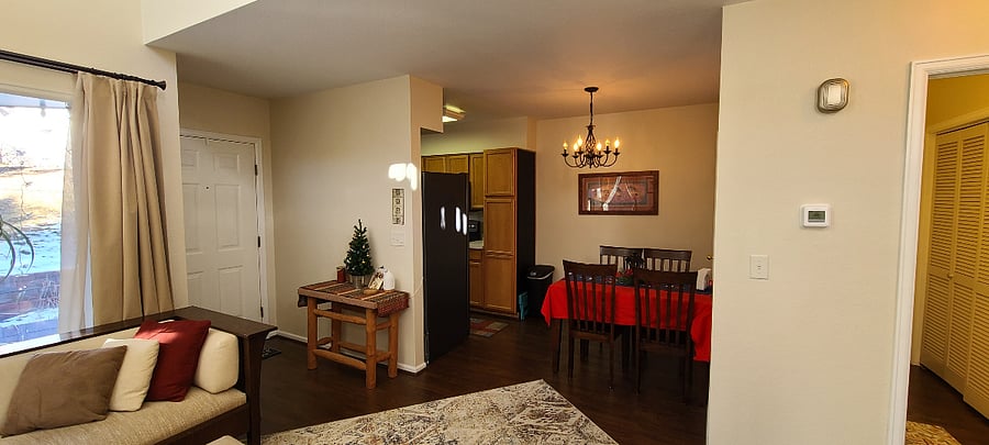 Living room flows effortlessly into dining room and hallway.