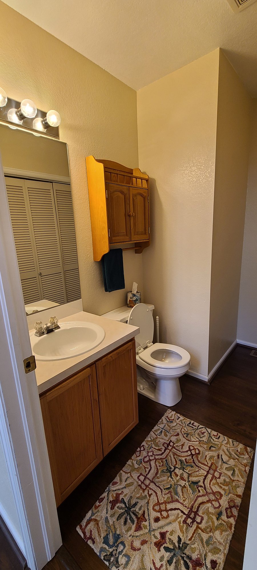 Downstairs bathroom located off living room w/ washer & dryer.