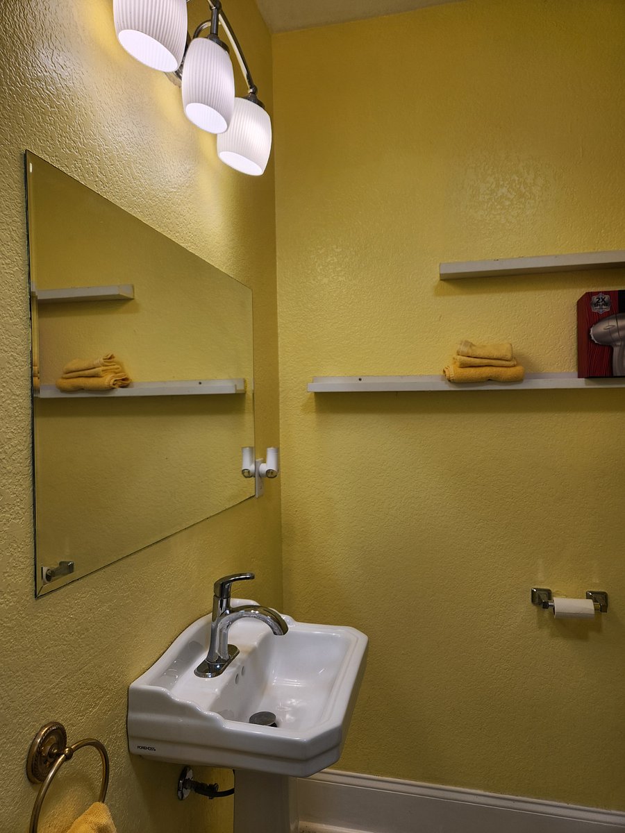 Lots of bathroom storage. Pedestal sink.