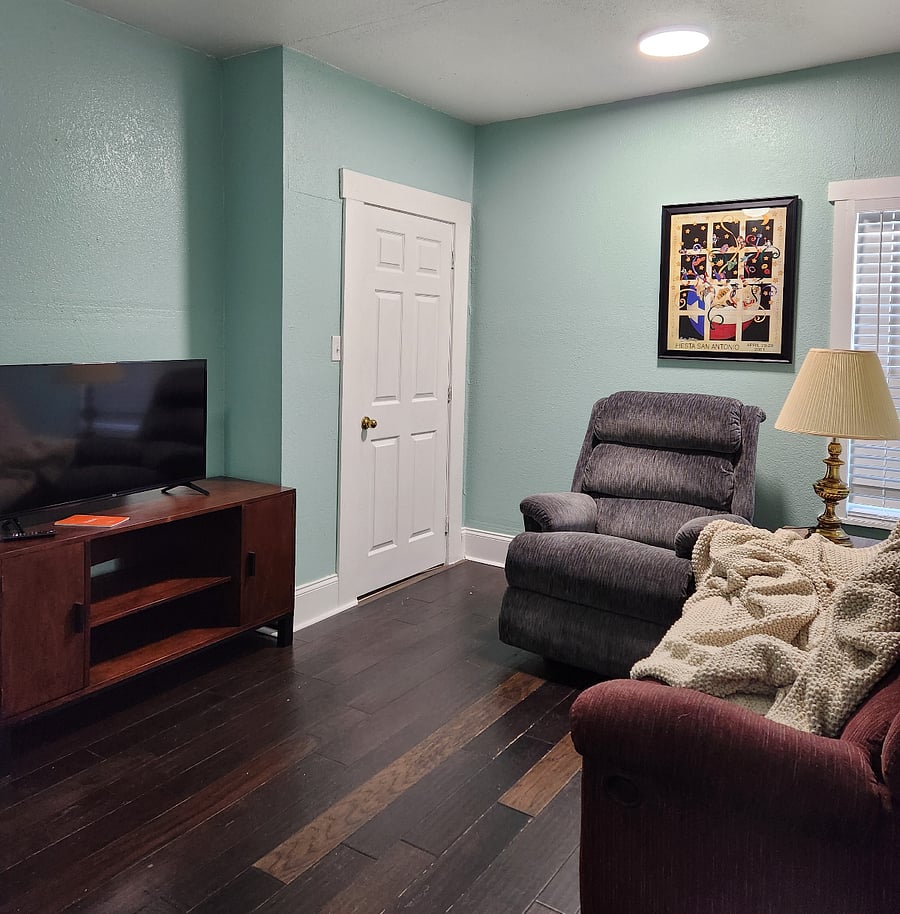 Fire TV in Theater room, door leads to utility room with washer/dryer and back door. Back door is steel with deadlock. Opens into gated back yard.