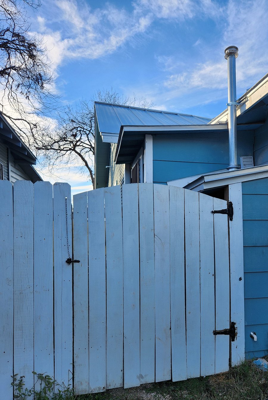 Gated, private back yard. Back door opens inside gated area. Security lights and cameras in this space.