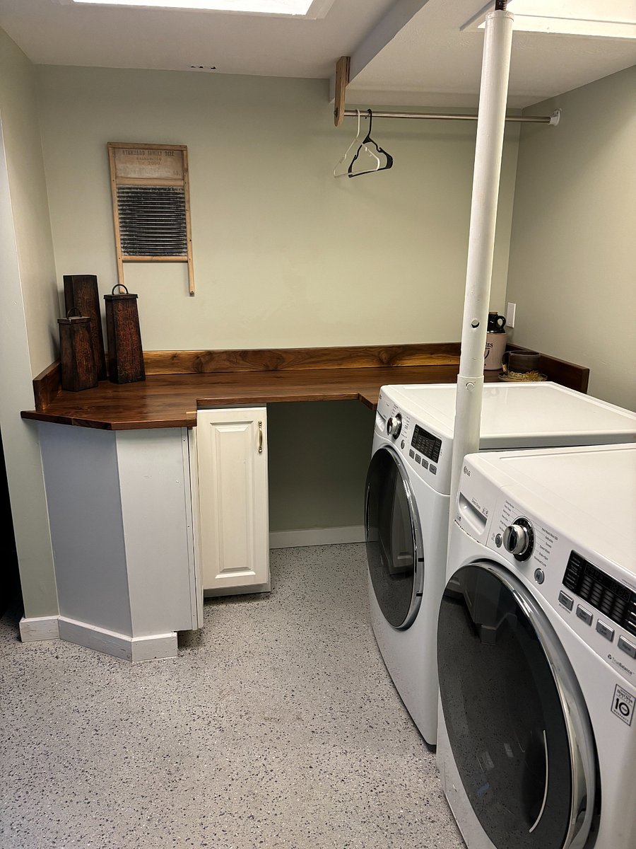 Laundry room right off mud room with custom builth folding cabinets. 
